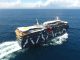 El crucero hibrido-electrico Magellan Discoverer navegando en Valdivia rumbo a la Antartica